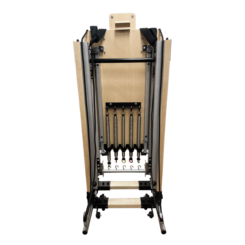 Rear view of vertically folded pilates reformer stored upright.