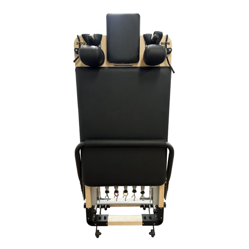 Lightweight pilates reformer folded vertically and stored upright.