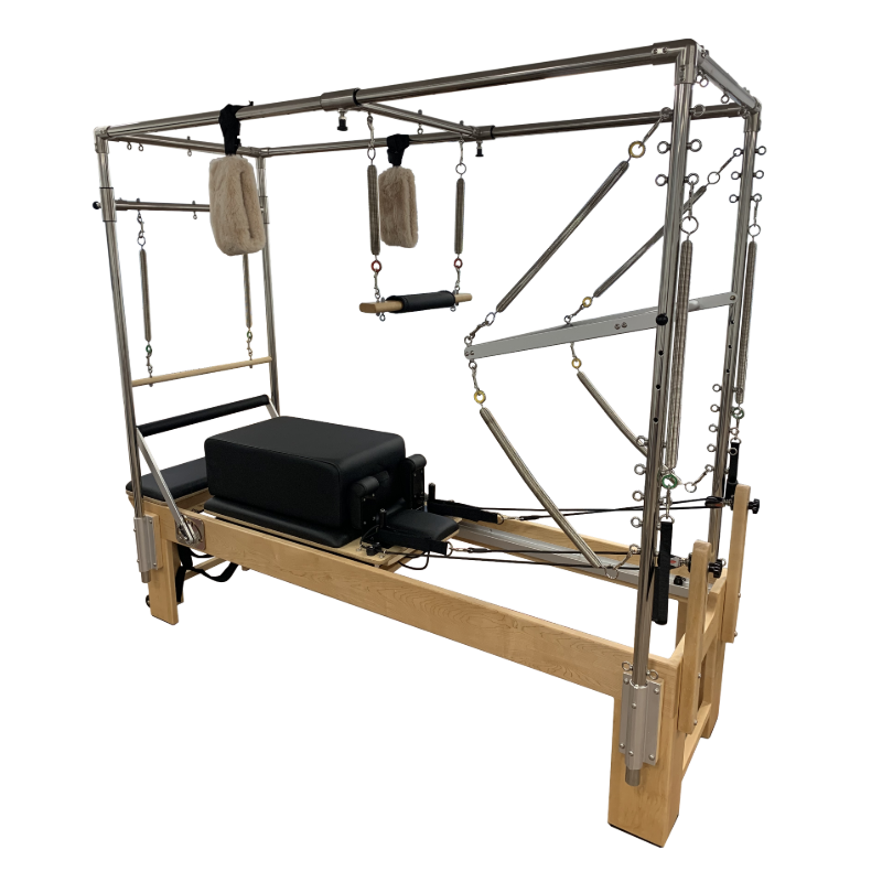 Pilates reformer machine with full trapeze attached and sitting box.