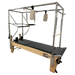 Light coloured wooden pilates reformer with black upholstery, with full metal trapeze and attachments.