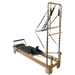 Wooden Reformer Pilates bed with stainless steel half trapeze attachment and black upholstery.