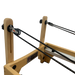 Close up of wooden reformer pilates machine showing cables and pulleys.