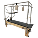 Light coloured wooden pilates reformer with black upholstery, with full metal trapeze and attachments.