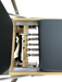 Close up of pilates reformer showing 5 colour coded springs.