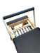 close up of wooden pilates reformer with black upholstery, showing 5 colour coded springs.