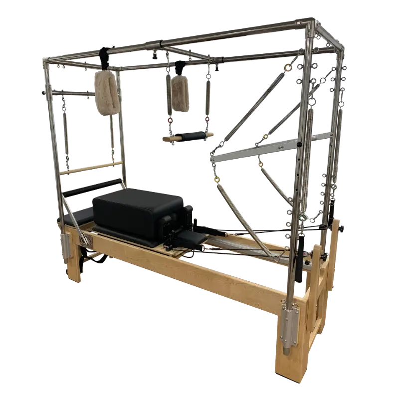 Pilates reformer machine with full trapeze attached and sitting box.