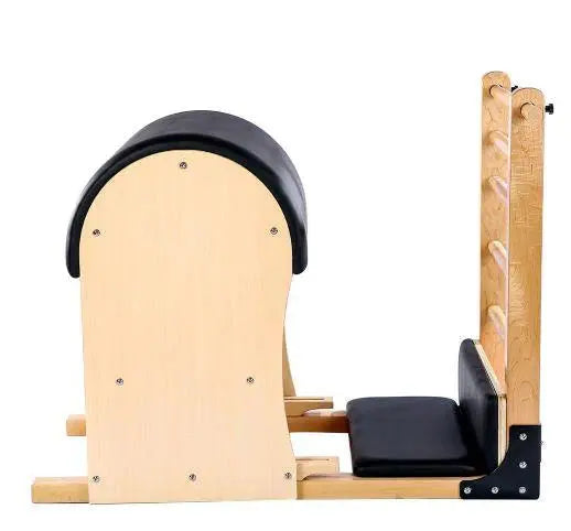 Premium Pilates Ladder Barrel from side with black upholstery and light coloured timber.