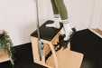 Woman standing on a Pilates Wunda Chair 