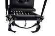 Close-up of a black Pilates reformer with a metal frame, straps, and a hanging hook, shown on a white background.