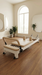 Core Collab Queen 2.0 Pilates reformer with white frame and beige upholstery in a studio setting with an arched window.