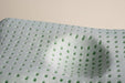 A close up view of the blackroll recovery kids pillow foam showing the holes in the foam.