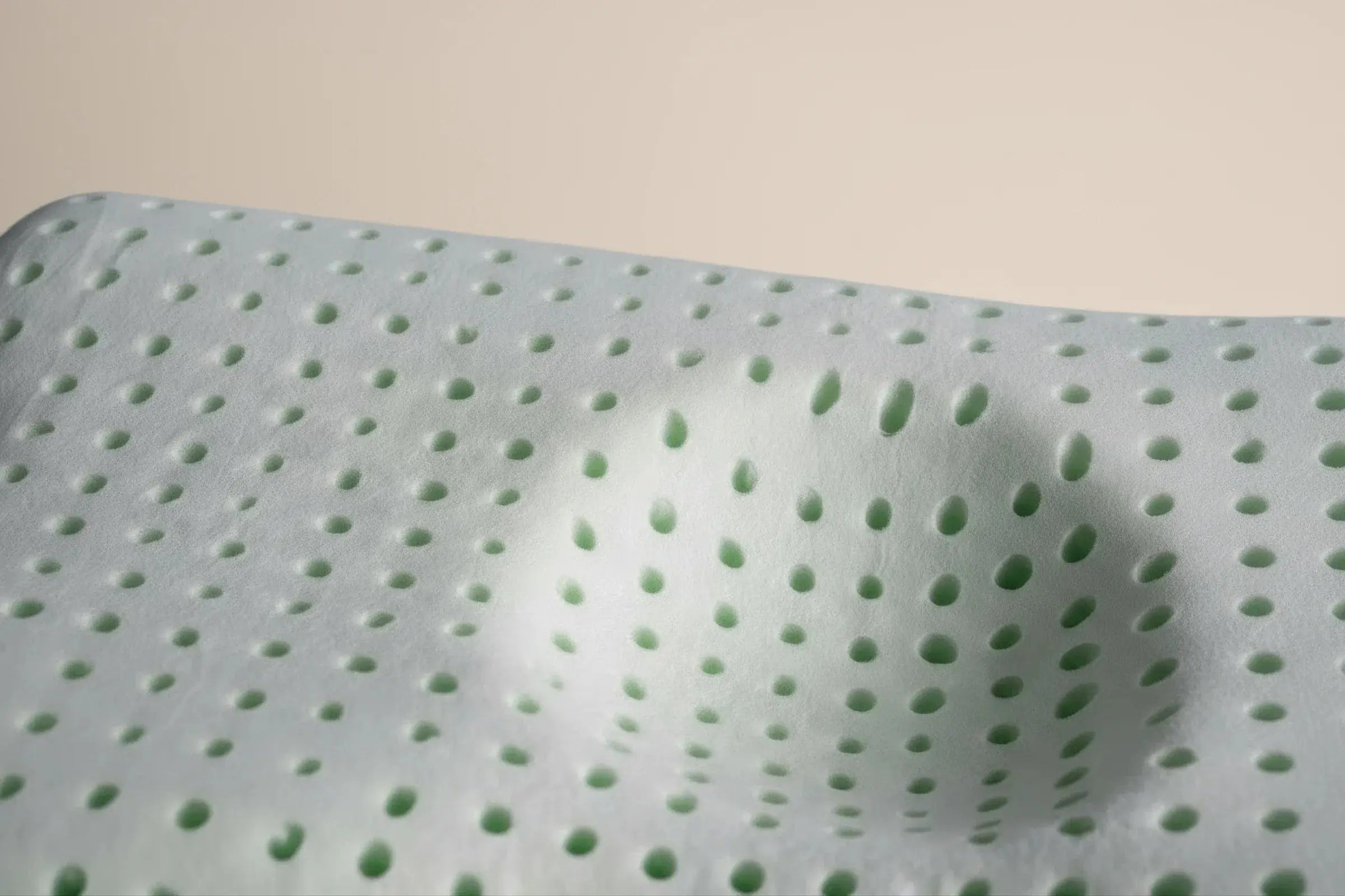 A close up view of the blackroll recovery kids pillow foam showing the holes in the foam.